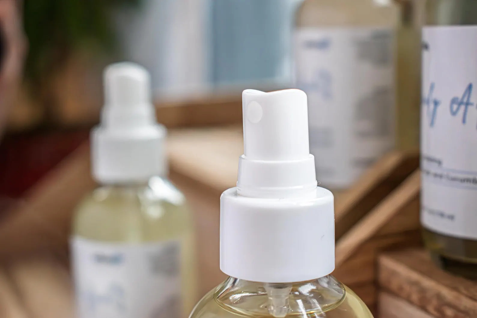 Close-up of Leafia Skincare  white spray nozzle on a Daily Aqua facial toner bottle.