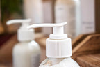 Leafia Skincare grass-fed tallow body lotion creamy daily moisturizer in close-up, highlighting white pump on clear bottle