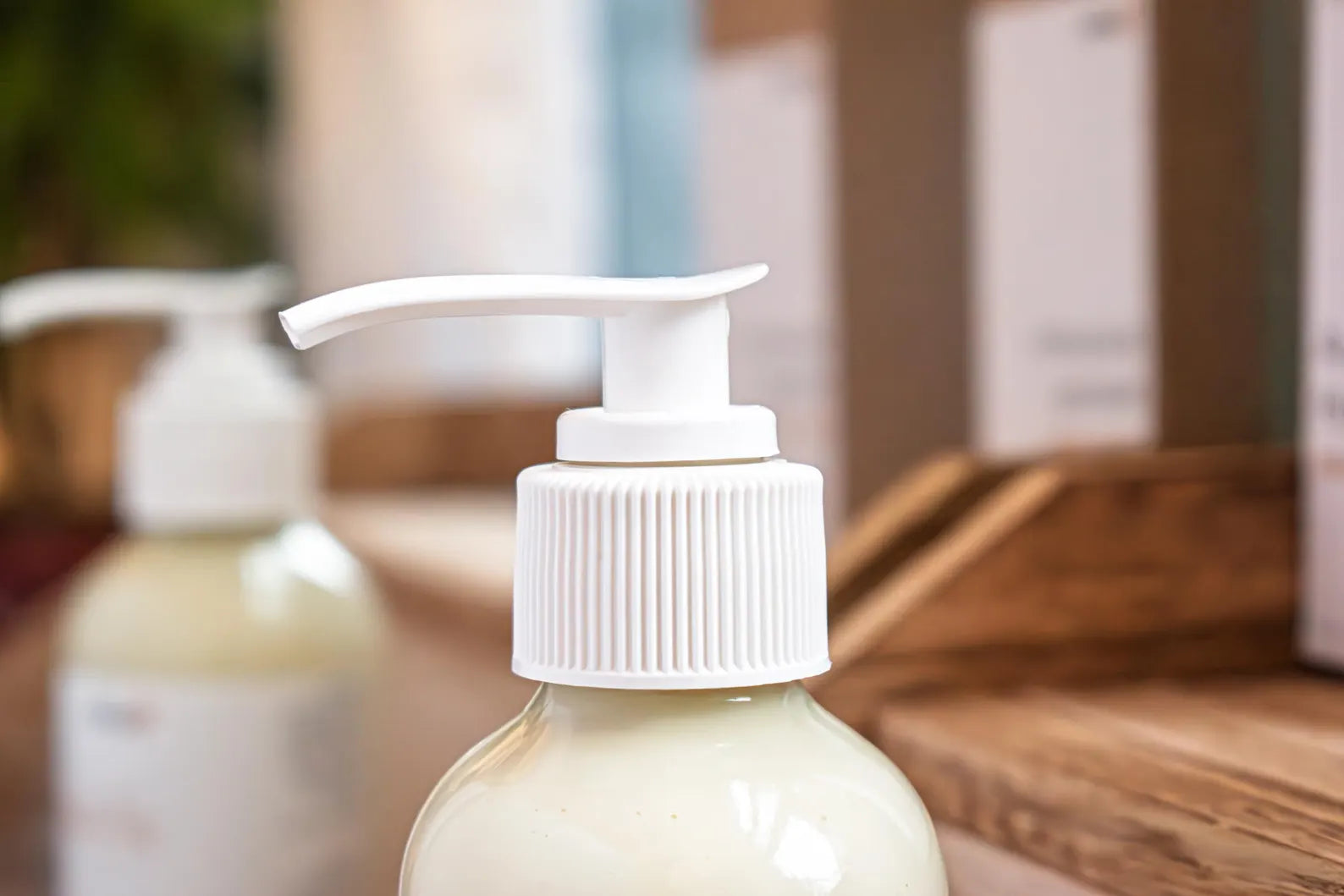 Close up pump of  Leafia Skincare nourishing body lotion made with honey, 