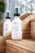 Leafia Skincare Green Tea Face Lotion lightweight hydrating moisturizer on wooden surface with blurred natural background