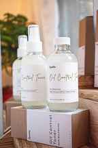 Leafia Skincare Oil Control Toner with witch hazel and aloe in clear glass spray bottle on wood with soft greenery accents