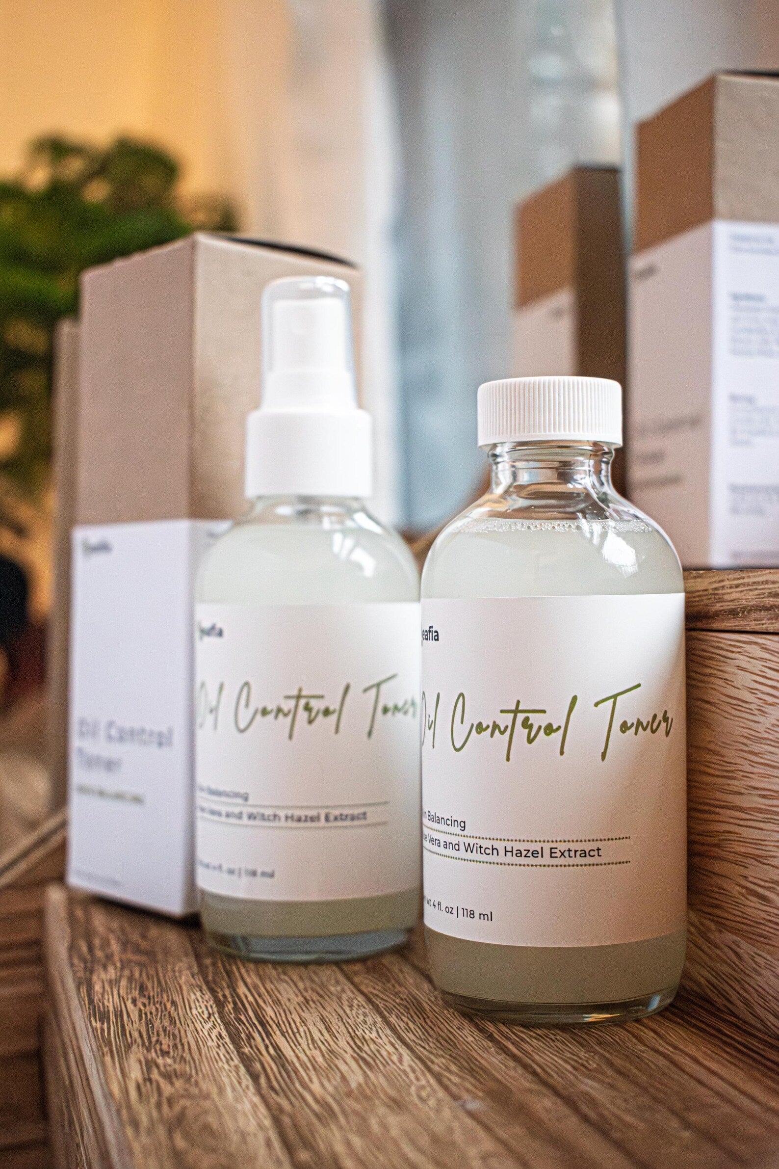Leafia Skincare oil control toner bottles on wooden surface with minimalist packaging in background