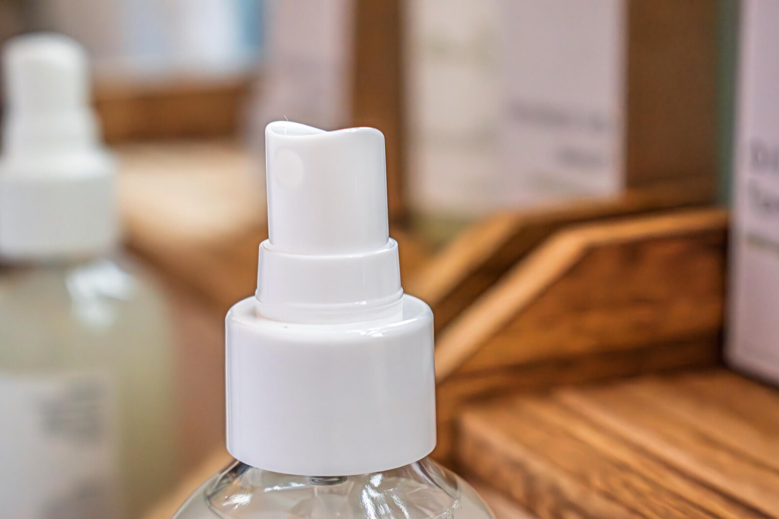Close-up of the white spray nozzle on an oil control facial toner bottle.