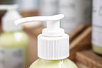 Leafia Skincare Matcha Green Tea gentle cream cleanser in close-up with white pump and soft diffused light