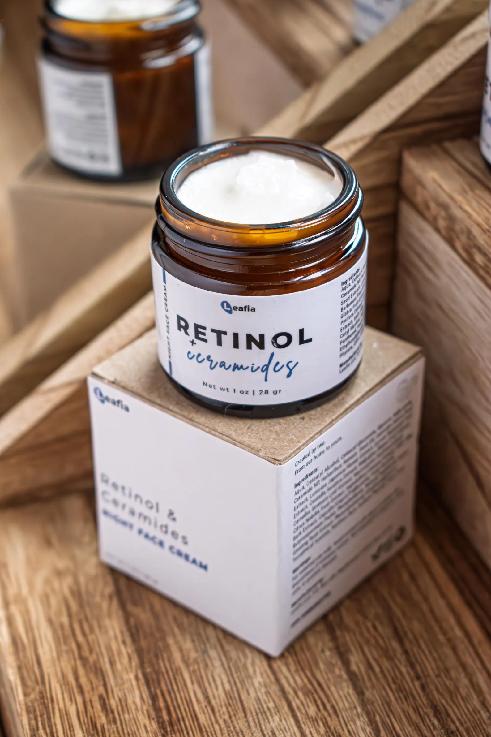 Leafia Skincare Retinol + Ceramides face cream open jar on wood, smooth white cream in lightweight barrier-supporting moisturizer