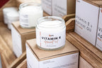 Leafia Skincare Vitamin E apricot oil lotion in open white jar, close-up highlighting smooth cream texture