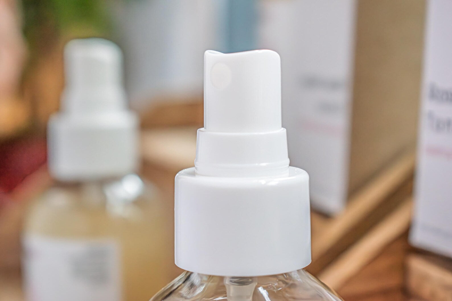 Leafia Skincare rose water toner gentle hydrating facial mist in close-up, highlighting white spray pump on clear bottle