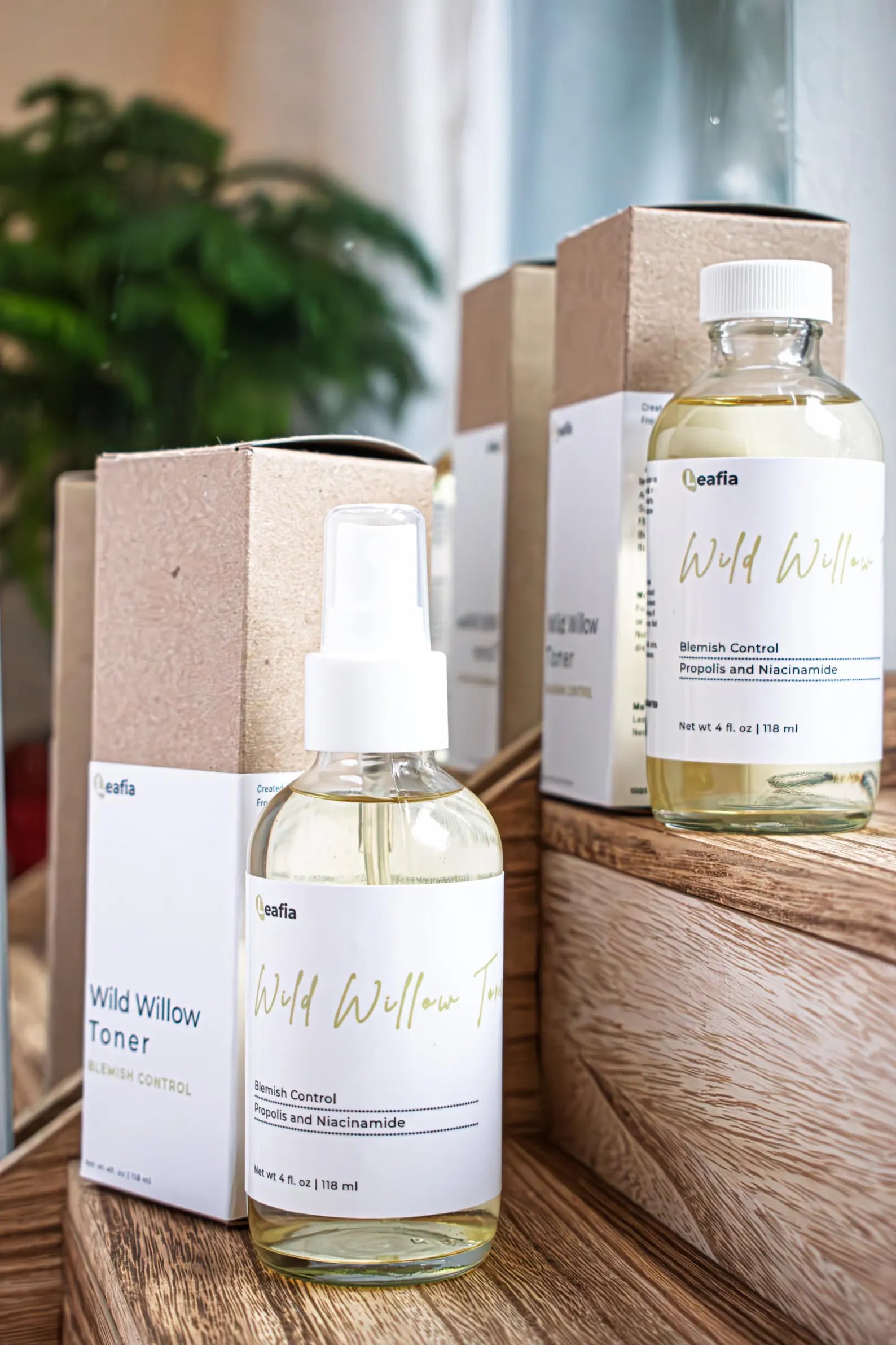 Leafia Skincare Wild Willow Toner bottles with boxes on wooden surface