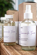 Leafia Skincare chamomile toner bottles on wooden surface with minimalist packaging in soft natural light