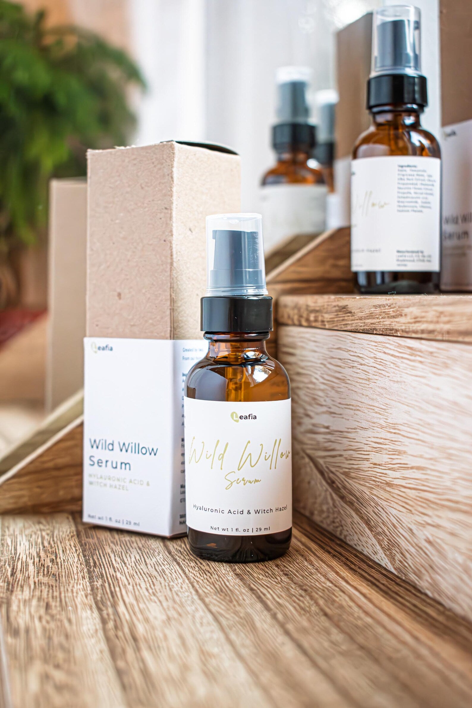 Leafia Skincare Wild Willow Serum bottle with packaging on wooden surface