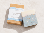 Bar of soap with a 'Confetti Hills' packaging on a light background