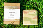 Bar of soap and its packaging on grass