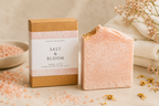 Bar of soap with packaging labeled 'Salt & Bloom' on a neutral background.